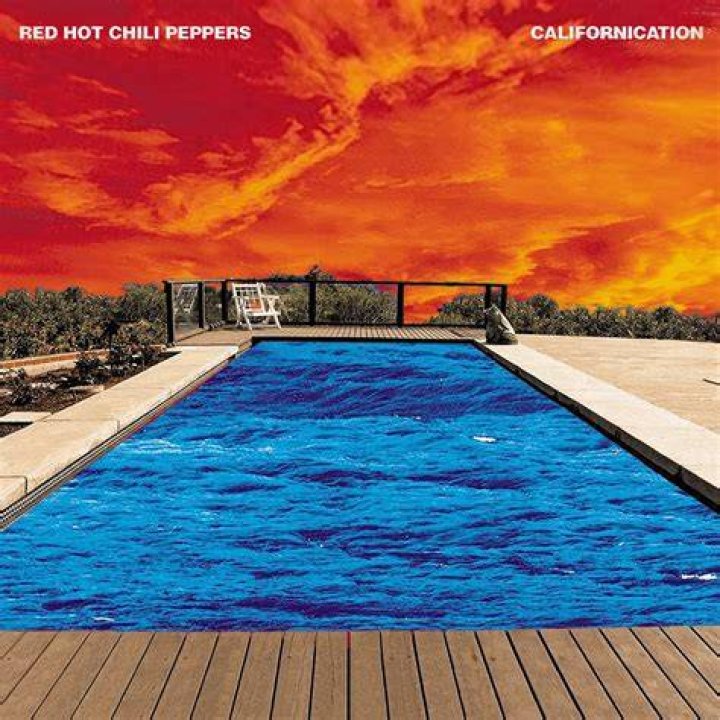 Red Hot Chilli Peppers' Anthony Kiedis holds hands with mystery