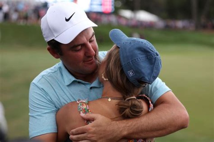 Scottie Scheffler hugs wife Meredith after Players Championship win